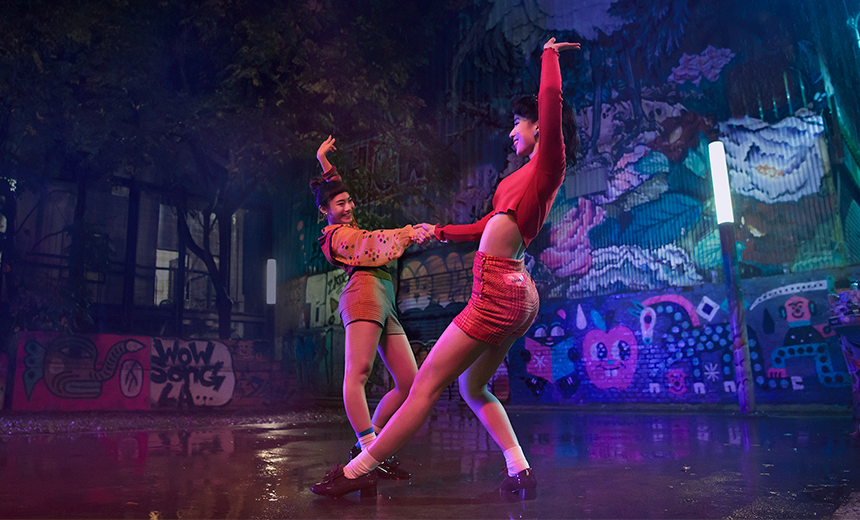 Two ladies dancing on stage